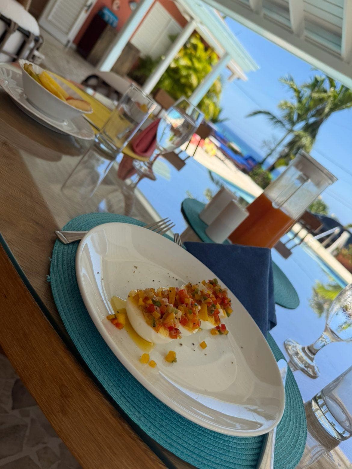 Villa lunch plate at a poolside table